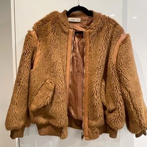 Teddy bomber with leather lining in a size medium women.